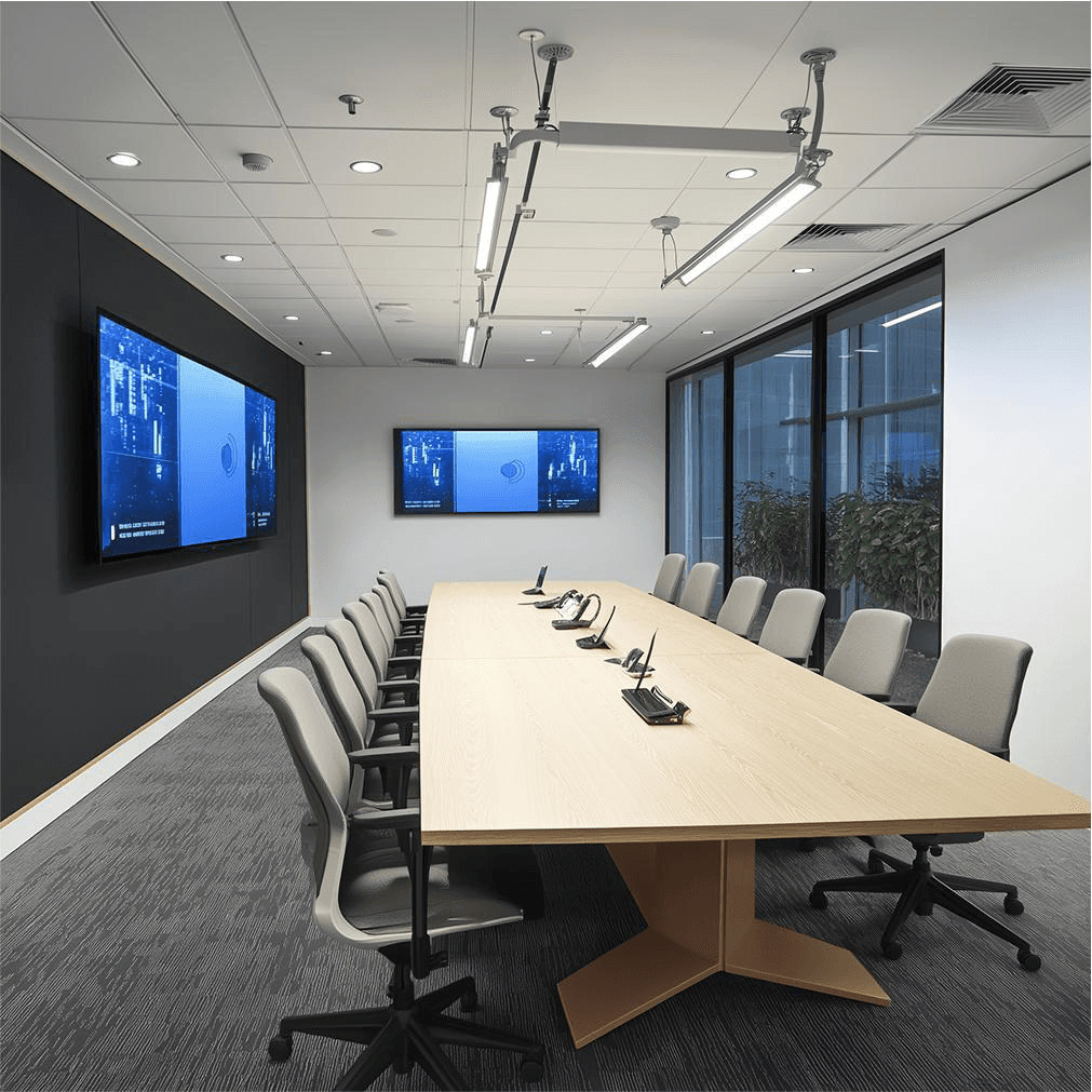 Conference room with wall displays and a meeting table