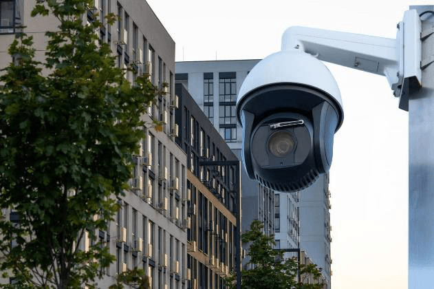 Exterior security camera mounted on a building