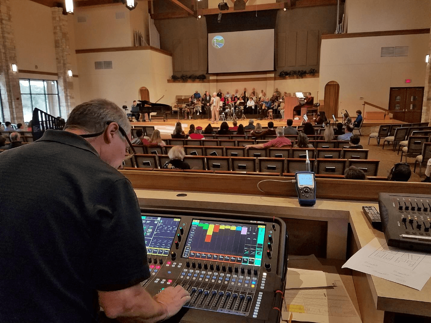 Audio operator mixing sound in a church sanctuary